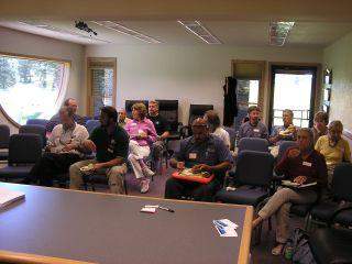 People gathered for an informational meeting about insurance